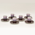 SUISSE LANGENTHAL TRANSITION - Conjunto de doze xícaras para café com pires de porcelana., predominando a decoração roxa e rosa. Marcas da manufatura no fundo. 7 x 7,5 cm  (xícara). 13 cm (pires).