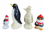 ESCULTURAS, lote com quatro (4) esculturas representando pinguins de modelos, tamanhos e decorações distintas, sendo 2 em porcelana e 2 em faianças, apresentam falhas na pintura, maior medindo 25cm e menor 14cm.