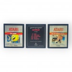 VIDEO GAMES, três (3) cartuchos de videogame para o sistema Atari 2600, sendo: A) Pac-Man, com etiqueta da Polyvox; B) Combat, código CX-2601, com diferentes modalidades de batalha; C) Air-Sea Battle  Batalha Aéreo-Naval, com etiqueta da Polyvox. Peças usadas, não testadas e sem garantia de funcionamento.