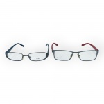 ÓCULOS, dois (2) óculos de grau, sendo: A) da marca Fendi, modelo F743, com armação retangular em metal escuro, hastes em plástico decoradas com monograma da marca, referência 5017-135, medindo 3x13x15cm e B) da marca A|X Armani Exchange, modelo AX1003, com armação retangular em metal escuro e hastes plásticas na cor vermelha, referência 6017-145, medindo 3,5x13,5x15,5cm.