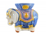 MOBILIÁRIO, um (1) seat-garden no feitio de elefante oriental, confeccionado em faiança vitrificada com pintura esmaltada em furtacor, apresenta leves bicados, vide foto, medindo 38x45x21cm.