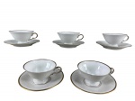 Edelstein (Bavaria), cinco (5) xícaras para café com seus respectivos pires, confeccionadas em porcelana alemã na tonalidade branca com borda e alça filetadas em ouro, medindo 4,5x9,5x8cm.