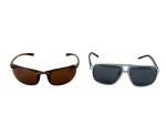 ACESSÓRIOS FEMININOS, dois (2) óculos de sol, sendo: A) 1 da manufatura POLARIZED, armação em baquelite imitando tortoise e lentes de tom marrom, sinais de uso, medindo 4x17x14,5cm e B) 1 da manufatura OXER, armação em plástico prateado, lentes escuras, medindo 5x14,5x14cm, leves sinais de uso.