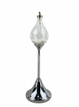 METAL PRATEADO e VIDRO, uma (1) lamparina a óleo "Clear Drops", inspirado nas criações de 1970 do designer dinamarquês Freddie Andersen, estrutura em metal prateado com base cônica e haste cilíndrica, bojo em vidro no formato de gota, medindo 29cm de altura.