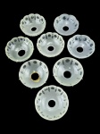 LUSTRES, oito (8) bobeches para montagem ou reposição de lustres confeccionados em vidro satine com lapidação de caneluras e esferas em baixo relevo, algumas com discretos bicados, medindo 10,5cm.