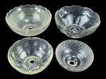 LUSTRES, lote com quatro (4) bacias para montagem ou reposição de lustres confeccionadas em vidro translucido de modelos distintos, podem conter ínfimos bicados e 1 com fio de cabelo, maior medindo 8,5x21cm e menor 6x14cm.