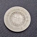 Brasil, moeda de cupro níquel de 100 réis de 1896, com curioso corte central. Danificada?