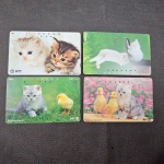 Japão, lote com 4 cartões de telefone "GATOS"