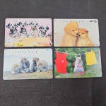 Japão, lote com 4 cartões de telefone "CÃES"