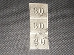 Brasil Império, trinca de 30 réis, Olho de Cabra, somente um selo tocando levemente o quadro. Valor de catálogo de 350 reais
