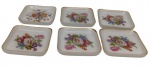 Saler. Conjunto com 6 petisqueiras em porcelana esmaltada, de formato quadrado com cantos arredondados, decorados com motivos florais policromados e bordas filetadas em ouro. Manufatura marcada no verso. Medidas: 7 x 7 cm.