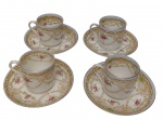 Conjunto com 4 xícaras para café com seus respectivos pires em faiança inglesa esmaltada, decorados com reservas em arabescos dourados, grinaldas e motivos florais policromados, com bordas filetadas em ouro. Manufatura marcada no verso. Duas xícaras apresentam fio de cabelo. Medidas: 6 x 11 x 11 cm.