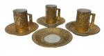 SALER. Conjunto com 3 xícaras para café e 4 pires em porcelana esmaltada, decorados com acabamento em ouro de efeito marmorizado, de inspiração Art Déco.
