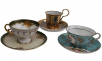 Três xícaras para chá com seus respectivos pires em porcelana esmaltada, de diferentes modelos e manufaturas, decoradas com reservas florais policromadas, rica ornamentação em ouro e bordas filetadas. Um pires com restauro.
