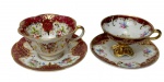 Duas xícaras de coleção para café em porcelana esmaltada e vitrificada, acompanhadas de seus respectivos pires. Uma da manufatura Vista Alegre, Portugal, com rica decoração floral policromada, reservas em tom vinho e ornamentação em dourado; e outra Mauá, com decoração floral policromada, fundo vinho e branca, ornamentação em arabescos e acabamento dourado. Manufaturas marcadas na base.