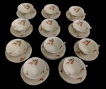 ROSENTHAL, Alemanhã Conjunto de xícaras de coleção para café em porcelana esmaltada, decorado com delicados motivos florais policromados e frisos prateados, composto por 11 xícaras e 12 pires. Uma xícara apresenta discretíssimo fio de cabelo.