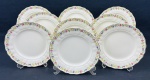 Grindley England - Marlborough Royal Petal "Greenway". Nove pratos rasos em faiança inglesa esmaltada, com bordas recortadas, decoração floral policromada e filete dourado. Manufatura no verso. Medidas: 23 cm de diâmetro. Craquelê. 4 com manchas.
