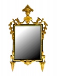 Extraordinário espelho italiano , com moldura de estrutura retangular na cor preta , com friso dourado sobreposto a toda volta e decorado ao redor com elementos florais e florão central em madeira entalhada e dourada a buril aplicados, séc XIX. Med. 1,02 x 73 cm