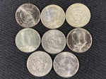 Moedas circuladas dos Estados Unidos da América, de 50 Cents (Kennedy Half Dollar), 1966 (peso 11,5 g  .400 prata e .600 cobre), 1969 D (peso 11,5 g  .400 prata e .600 cobre), 1971 D, 1974, 1974 D, 17761976 D, 1977, 2005 D.