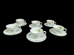Conjunto vintage, em porcelana, marca Renner, com decoração floral, composto de: 6 xícaras para cafezinho e 6 pires.