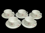 Conjunto com 5 xícaras para chá com seus respectivos pires, em porcelana nacional marca Pozzani, com detalhes em decoração floral.