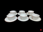 6 xícaras e seus respectivos pires para chá, em antiga porcelana branca brilhante, monogramada, com detalhes na cor rouge de fer, marca na base não identificada. (possivelmente francesa - antiga pode haver desgaste na pintura - favor verificar).