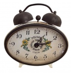 Relógio despertador POLVAN, modelo de dupla campainha, caixa metálica esmaltada, mostrador oval com decoração floral e inscrição European Tour Ref. Hours  Genova (Italia), fabricação West Germany. Apresenta sinais compatíveis com o uso e o tempo. Periodo 1900. Funcionamento desconhecido. Medidas: 8  9 cm.