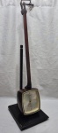 Antigo relógio japonês da marca Citizen, modelo Transistor Clock, moldura em madeira. Medindo 76cm de altura. Não testado, faltando a peça para segurar.
