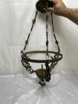 Lustre de teto em metal dourado trabalhado com relevos. Medindo 28cm de diâmetro x 57cm de altura total.