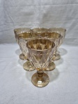 Jogo de 6 taças de água, vinho em vidro âmbar ricamente moldado. Medindo 9cm x 17cm de altura.