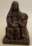 Imagem de madeira entalhada com resquícios de policromia, representando Sant´Ana Mestra.  15,5 x 9 x 23,5 cm de altura. Brasil. Séc. XVIII/XIX