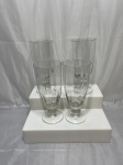 Jogo de 4 tulipas de cerveja em cristal canelado. Medindo 7,5cm x 18cm de altura.