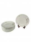 Schmidt | Magnífico jogo com 11 pratos rasos de jantar em porcelana branca com primorosa decoração floral, peças clássicas da renomada manufatura. Marcas do tempo. -dim- 24cm D.