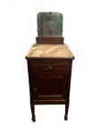 Mesa de cabeceira em madeira nobre, cerca de 1920, Brasil, com espelho bisotado preso por garras em bronze, tampo em mármore rosa rajado, uma gaveta e uma porta. -dim- 35x36x110cm.