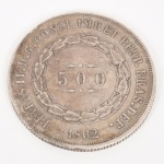 NUMISMÁTICA, Brasil, Império, uma (1) moeda de 500 reis 1862, cunhada em prata, 3 sistema monetário, 2 tipo, 6,3 gr., 25,5 mm diâmetro, 1,3 mm espessura, bordo serrilhado, 2 reinado, D. Pedro II, muito bom estado de conservação, anverso: dístico do valor de face, circundado por guirlanda de tulipas, na orla a legenda PETRUS II D. G. CONST. IMP. ET PERP. BRAS. DEF., seguido do ano de cunhagem feita a época na Província do Rio de Janeiro; reverso: no enxergo brasão do império encimado pela legenda IN HOC SIGNO VINCES.