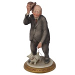 CAPODIMONTE 1966. Designer: Giuseppe Cappé - Rara estatueta italiana em porcelana policromada representando idoso caminhando com cachorro. 16 x 8 cm.