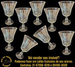 CONJUNTO DE TAÇAS EXECUTADAS EM DEMI-CRISTAL, APRESENTANDO BOJO EM FORMATO DE TULIPA LEVEMENTE ABERTO, DECORADO COM LAPIDAÇÃO GEOMÉTRICA EM GOMOS VERTICAIS, HASTE CURTA TORNEADA COM ANÉIS EM RELEVO SOBRE BASE CIRCULAR, COMPOSTO POR NOVE PEÇAS, MEDINDO 14 X 9,5 CM CADA. APRESENTAM MARCAS DO TEMPO, USO, DESGASTES E/OU IMPERFEIÇÕES COMPATÍVEIS COM SUA UTILIZAÇÃO E ESTADO DE CONSERVAÇÃO, CONFORME FOTOS EXTRAS. ESCLAREÇA TODAS AS DÚVIDAS ANTES DE EFETUAR SEU LANCE, QUE SERÁ CONSIDERADO IRREVOGÁVEL E IRRETRATÁVEL. CONSULTE PREVIAMENTE OS TERMOS E CONDIÇÕES DISPONÍVEIS NO SITE. CONTATO VIA TELEFONE OU WHATSAPP: (21) 98264-3000. 