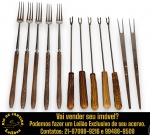 CONJUNTO, PARTE DE SERVIÇO DE MESA, IDEAL PARA COMES E BEBES, EXECUTADO EM AÇO INOXIDÁVEL, MARCAS, MODELOS, MEDIDAS, FORMATOS, TAMANHOS, UTILIDADES E PROCEDÊNCIAS DIVERSOS COMPOSTO POR DOZE GARFOS, SENDO: DOIS TRINCHANTES, MADE IN JAPAN, COM CABOS EM MADEIRA NATURAL FIXADOS POR REBITES METÁLICOS, DENTES LONGOS E ROBUSTOS; CINCO PARA CHURRASCO E/OU PETISCOS, MARCA EBERLE, COM CABOS TORNEADOS EM MADEIRA NATURAL ENVERNIZADA E CINCO PARA PETISCOS E/OU FONDUE, COM CABOS EM MADEIRA NATURAL TORNEADA E ENVERNIZADA E PONTAS BIFURCADAS. APRESENTAM MARCAS DO TEMPO, USO, DESGASTES E/OU IMPERFEIÇÕES COMPATÍVEIS COM SUA UTILIZAÇÃO E ESTADO DE CONSERVAÇÃO, CONFORME FOTOS EXTRAS. ESCLAREÇA TODAS AS DÚVIDAS ANTES DE EFETUAR SEU LANCE, QUE SERÁ CONSIDERADO IRREVOGÁVEL E IRRETRATÁVEL. CONSULTE PREVIAMENTE OS TERMOS E CONDIÇÕES DISPONÍVEIS NO SITE. CONTATO VIA TELEFONE OU WHATSAPP: (21) 98264-3000. 