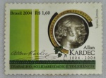 Selo postal comemorativo brasileiro emitido em 3 de outubro de 2004, em homenagem aos 200 anos do nascimento de Allan Kardec (18041869), sob o tema Trabalho, Solidariedade e Tolerância. Catalogação RHM C-2597 / Michel BR 3393. Exemplar sem obliteração, com dentição preservada e sinais de alteração na goma do verso, em estado de conservação conforme fotografias.