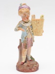 Escultura em porcelana representando garoto com cesto. Altura: 19cm. ( no estado )