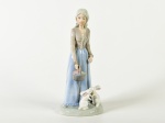 MONTIPIERO - Escultura em porcelana espanhola esmaltada e vitrificada, representando dama com coelhos. Altura: 20cm.