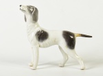 Escultura em porcelana esmaltada e vitrificada, representando cachorro. No estado. Medidas: 15 x 17 x 4,5cm.