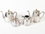 WOLFF - Parte de serviço para chá e café em metal espessurado a prata, composto de 1 bule para chá, 1 bule para café, 1 leiteira e 1 açucareiro. Total de 4 peças, apresentam pontos de desgaste no banho.