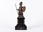 Escultura em bronze representando a deusa grega ATHENA, com vestígio de aplicação de pátina dourada, sobre base em mármore com aplicação de motivos florais. Altura da escultura: 24cm; Altura total: 41cm.
