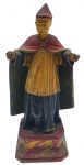 ARTE SACRA - Antiga imagem com a representação do Santo Bispo, no estilo Barroco, em madeira nobre policromada. Medidas: 20 x 7 cm. Dedo de uma das mãos com dano; pintura com desgastes.