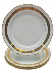 BARÃO DO RIO BRANCO, MADE IN BRAZIL - Parte de serviço de jantar com 04 pratos rasos decorados em dourado com filetes e faixa com motivos florais. Em porcelana. Medidas: 24 cm.
