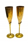 Par de taças para espumante em bronze. Medidas: 24 x 5,5 cm.