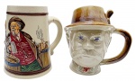 CERAMARTE / CANECAS SÃO JOAQUIM - 02 diferentes canecas, sendo uma escultórica, representando a face de um alemão; e a outra decorada em relevo com figuras masculinas em trajes de época tipicamente alemães. Em cerâmica esmaltada policromada. Medidas: 15 x 14 cm; 14 x 14 cm.