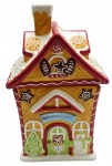 Potiche com a representação de uma casa de temática natalina, e telhado removível como tampa. Em cerâmica esmaltada multicolorida. Medidas: 30 x 18 x 15 cm.