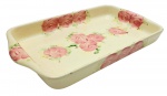 WEISS - Travessa retangular adornada com coloridos motivos florais sobre fundo marfim; em cerâmica esmaltada. Medidas: 40 x 24 cm. Com ínfimos bicados na borda.